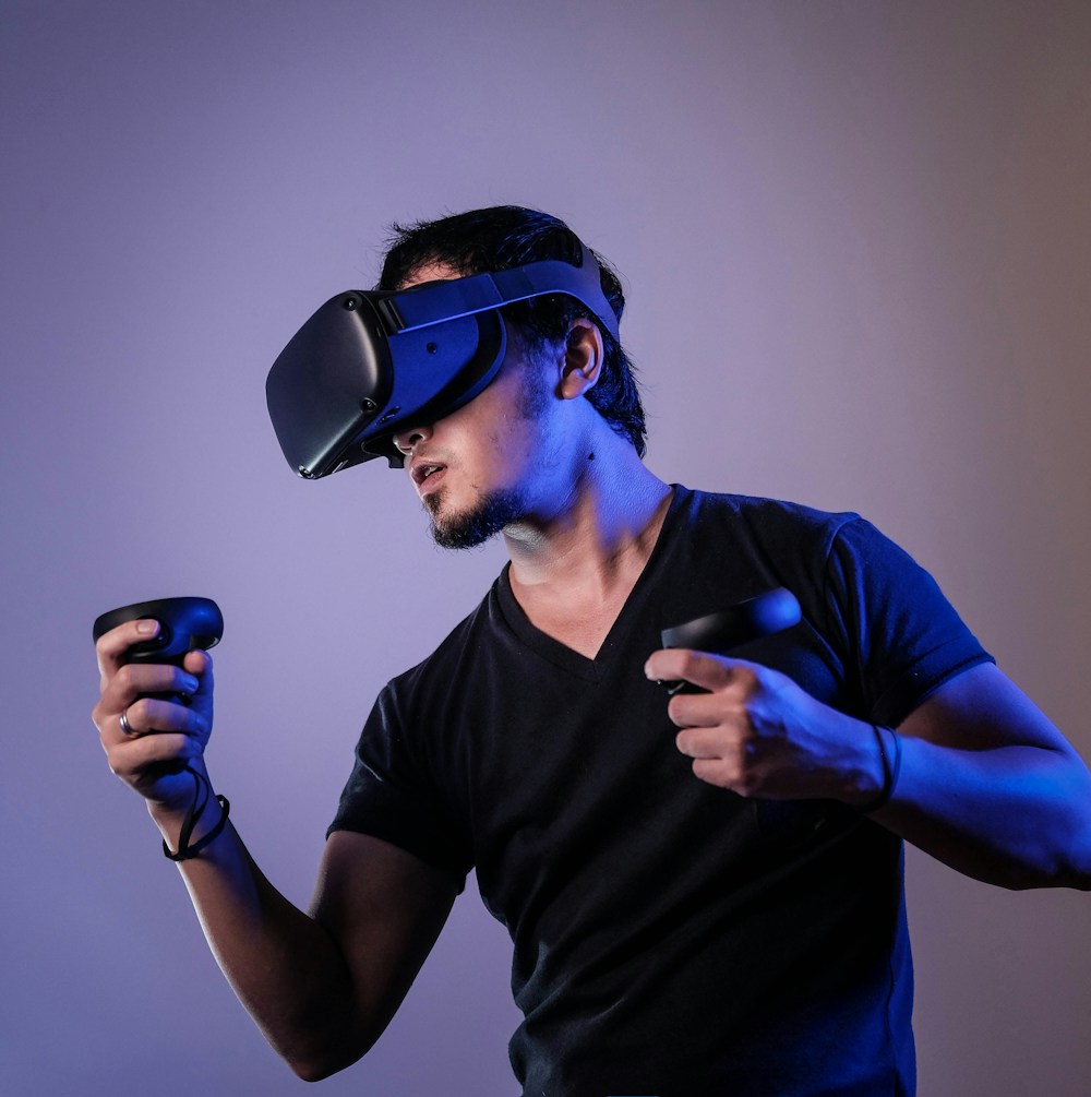 A person wearing a VR headset and holding motion controllers